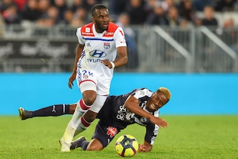 Lyon's French midfielder Tanguy Ndombele (L) vies with Bordeaux's Guinean forward Francois Kamano (R) during the French L1 football match between Bordeaux (FCGB) and Lyon (OL) on April 26, 2019 at the Matmut Atlantique stadium in Bordeaux, southwestern Fr