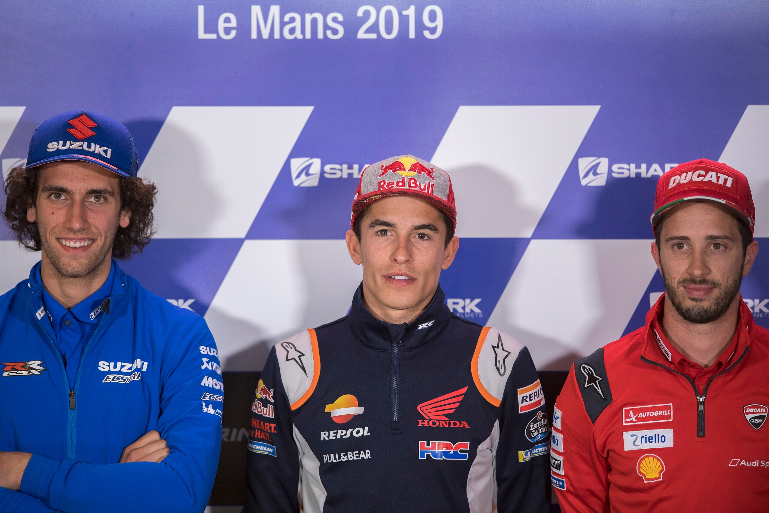LE MANS, FRANCE - MAY 16: (L-R) Alex Rins of Spain and Team Suzuki ECSTAR, Marc Marquez of Spain and Repsol Honda Team and Andrea Dovizioso of Italy and Ducati Team  pose during the press conference pre-event during the MotoGp of France - Previews on May 