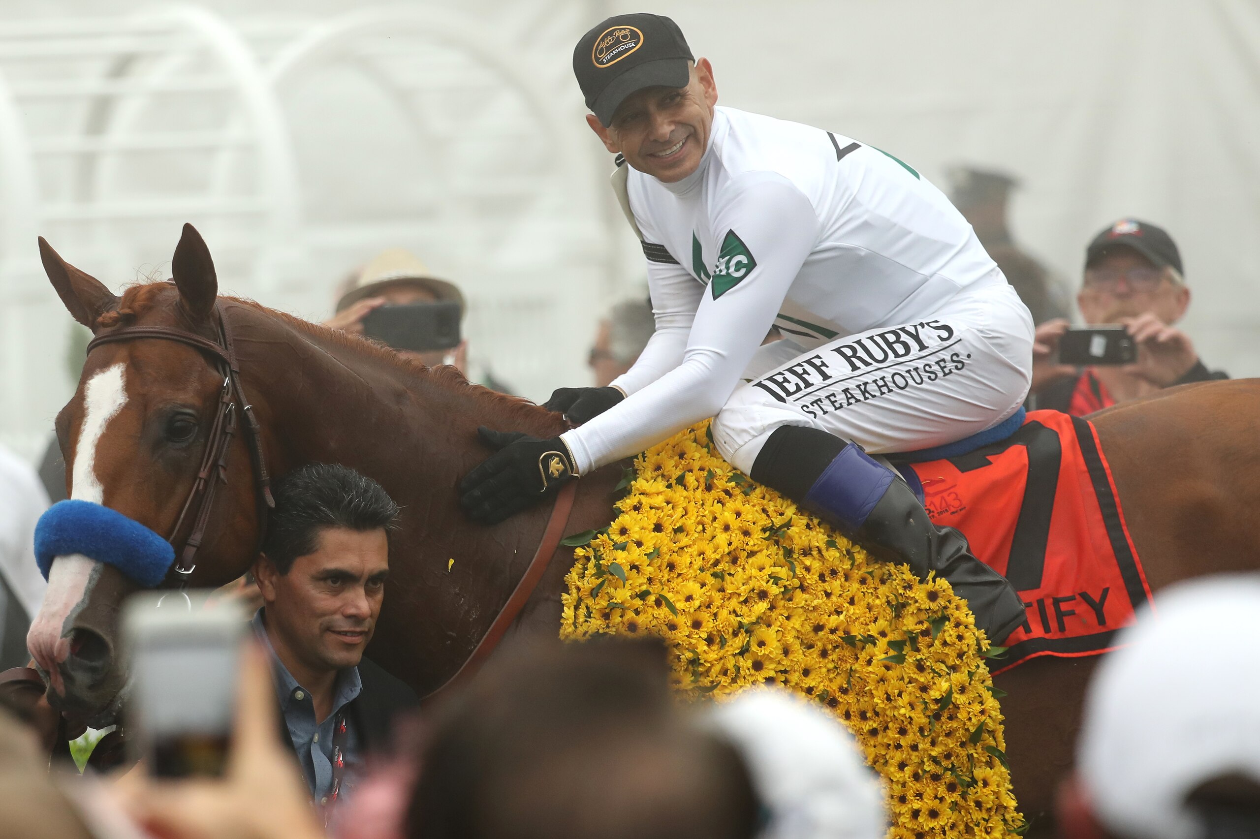 BALTIMORE, MD - MAY 19: Justify #7 ridden by jockey Mike Smith celebrates after winning the 143rd running of the Preakness Stakes at Pimlico Race Course on May 19, 2018 in Baltimore, Maryland. (Photo by Rob Carr/Getty Images)