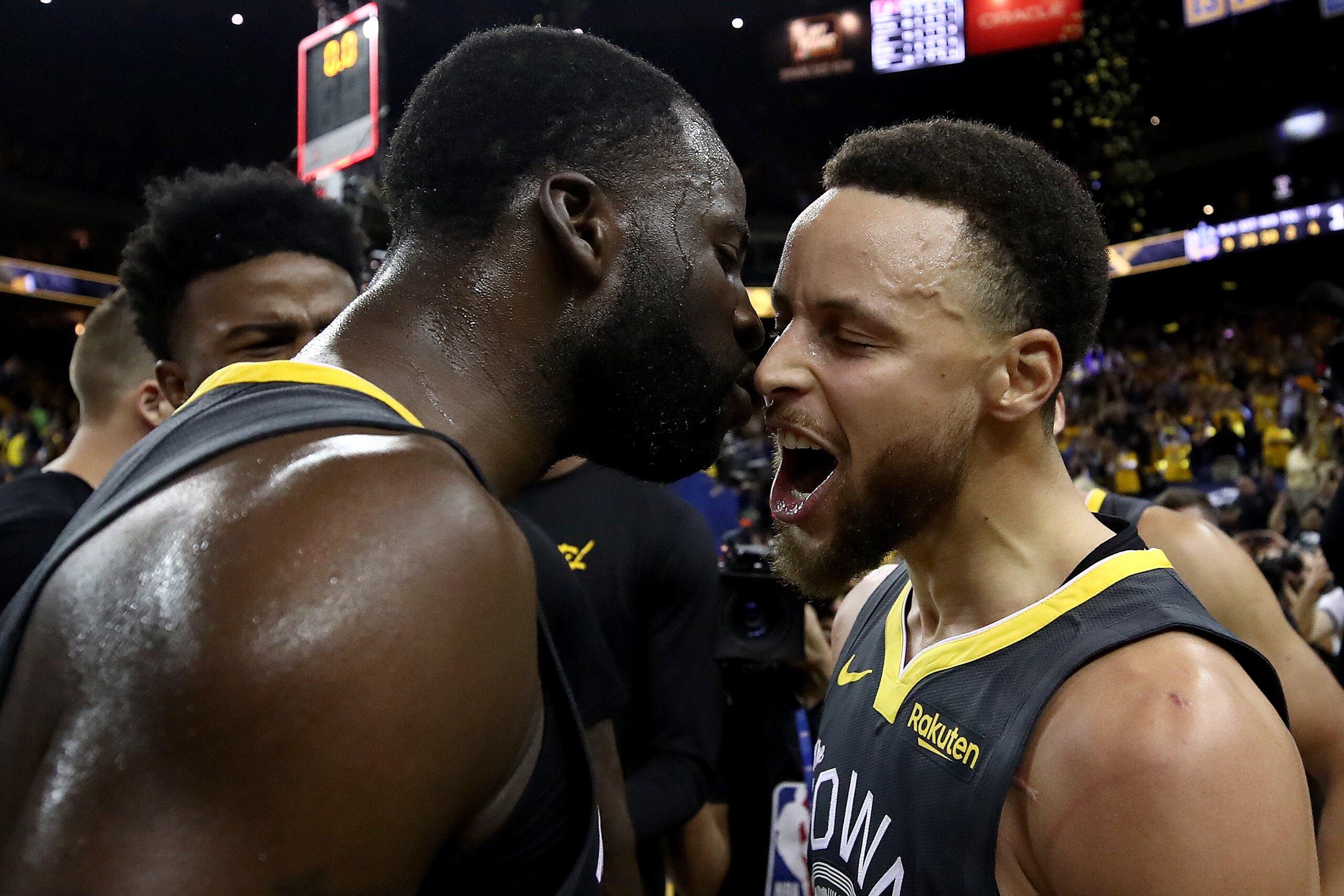 OAKLAND, CALIFORNIA - MAY 16: Stephen Curry #30 and Draymond Green #23 of the Golden State Warriors celebrate after defeating the Portland Trail Blazers 114-111 in game two of the NBA Western Conference Finals at ORACLE Arena on May 16, 2019 in Oakland, C