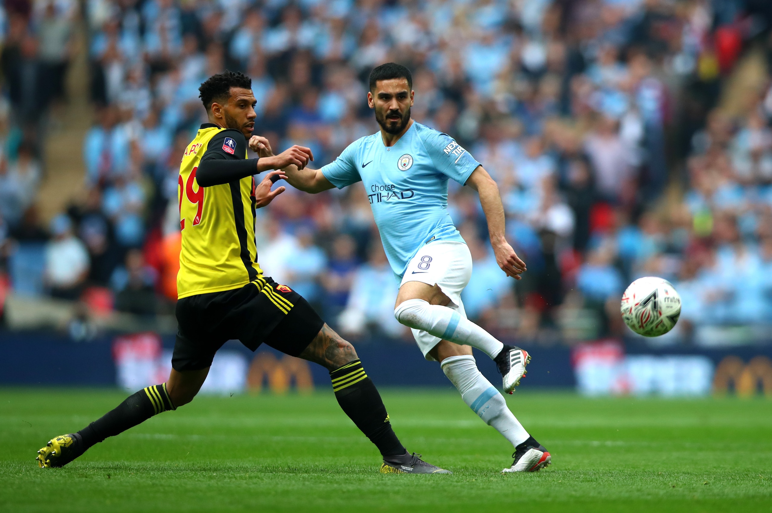 LONDON, ENGLAND - MAY 18: Etienne Capoue of Watford FC and Ilkay Gundogan of Manchester City in action during the  Emirates FA Cup Final match between Manchester City and Watford FC at Wembley Stadium on May 18, 2019 in London, England. (Photo by Chloe Kn