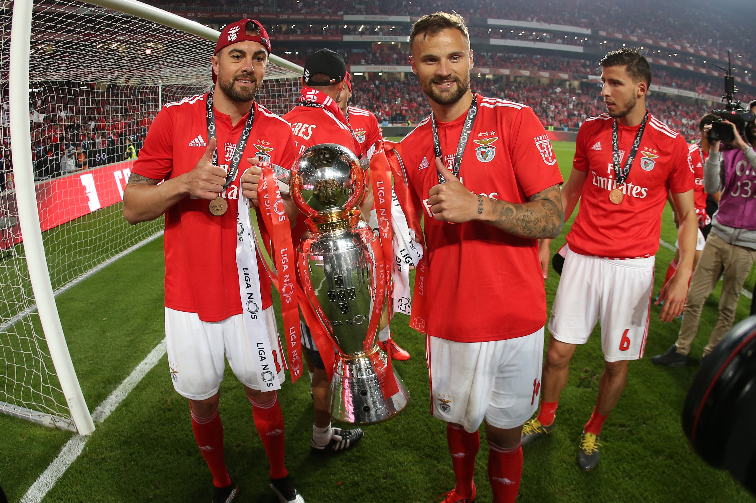 LISBON, PORTUGAL - MAY 18: Haris Seferovic of SL Benfica and Jardel of SL Benfica celebrate with trophy after winning the Liga NOS Championship at the end of the Liga NOS match between SL Benfica and CD Santa Clara at Estadio da Luz on May 18, 2019 in Lis
