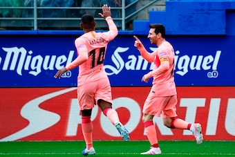 Barcelona's Argentinian forward Lionel Messi (R) celebrates with Barcelona's Brazilian midfielder Malcom after scoring a goal during the Spanish League football match between Eibar and Barcelona at the Ipurua stadium in Eibar on May 19, 2019. (Photo by ST