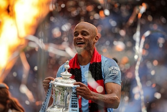 LONDON, ENGLAND - MAY 18: Vincent Kompany of Manchester City lifts the trophy following the FA Cup Final match between Manchester City and Watford at Wembley Stadium on May 18, 2019 in London, England. (Photo by Richard Heathcote/Getty Images)