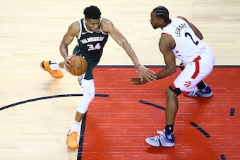TORONTO, ONTARIO - MAY 19: Giannis Antetokounmpo #34 of the Milwaukee Bucks drives to the basket against Kawhi Leonard #2 of the Toronto Raptors during the second half in game three of the NBA Eastern Conference Finals at Scotiabank Arena on May 19, 2019 