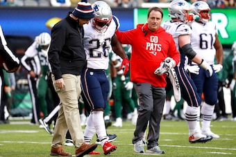 EAST RUTHERFORD, NEW JERSEY - NOVEMBER 25: Sony Michel #26 of the New England Patriots is helped off the field after getting hurt during the fourth quarter at MetLife Stadium on November 25, 2018 in East Rutherford, New Jersey. (Photo by Jeff Zelevansky/G