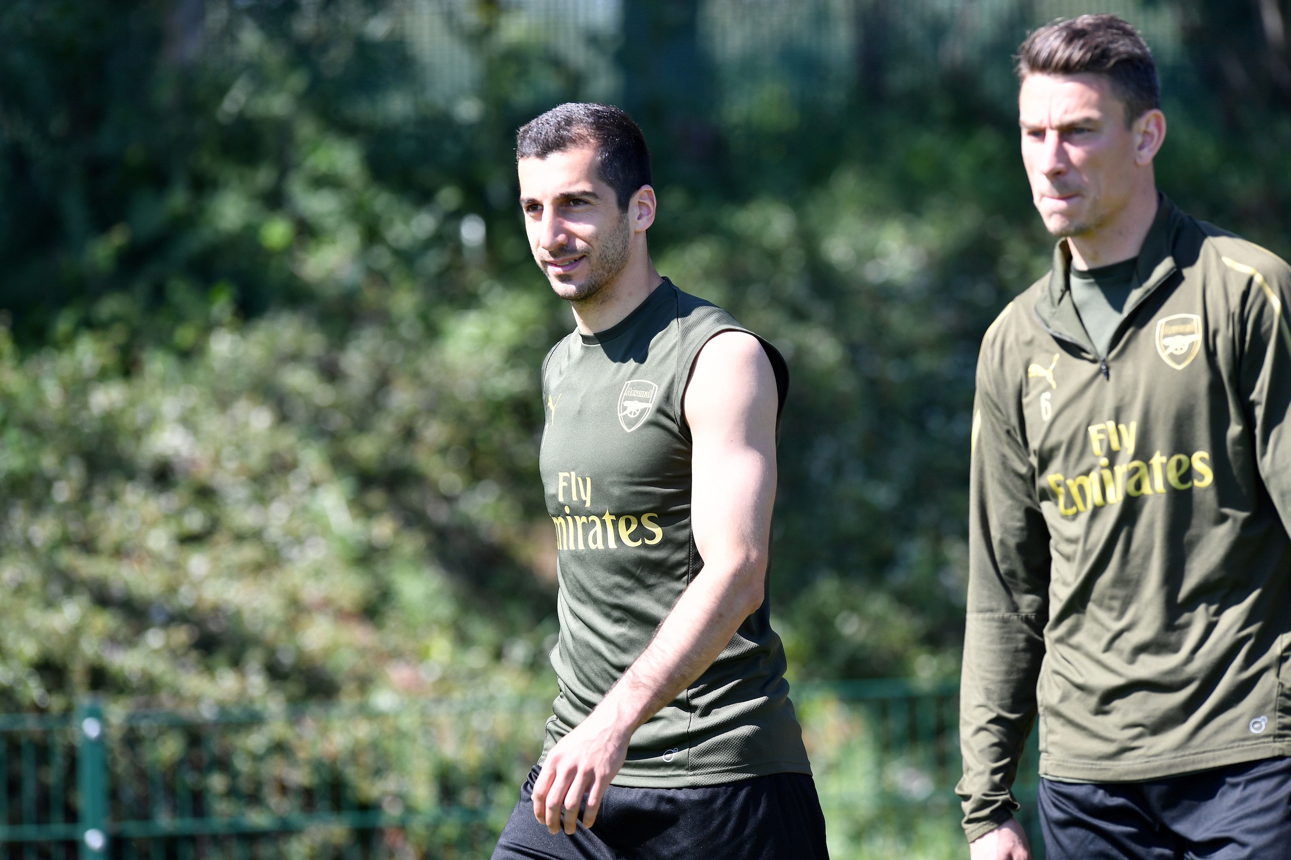 Arsenal's Armenian midfielder Henrikh Mkhitaryan (L) and Arsenal's French defender Laurent Koscielny attend a training session at Arsenal's London Colney training centre in St. Albans on May 21, 2019 ahead of their Europa League final football match again