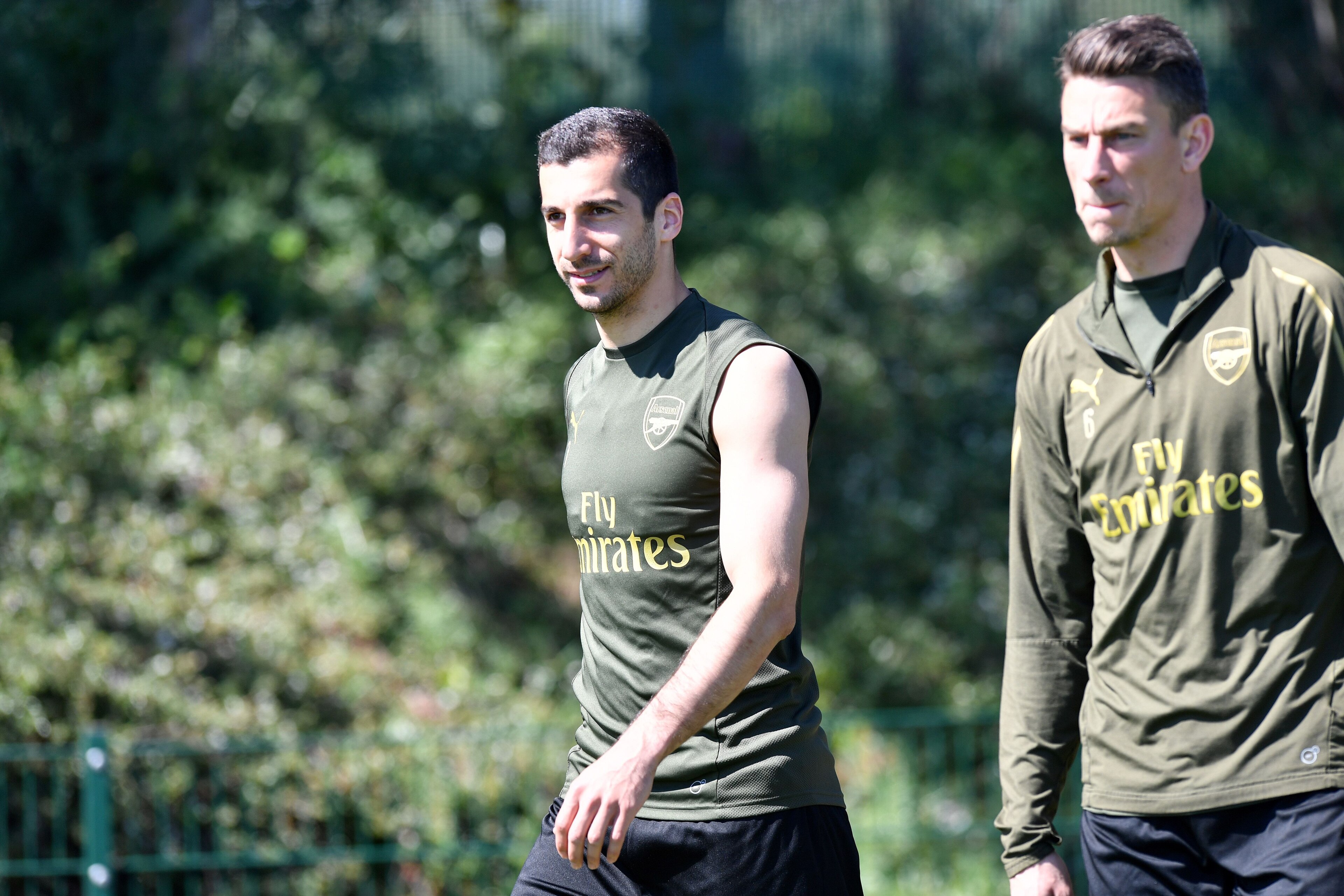 Arsenal's Armenian midfielder Henrikh Mkhitaryan (L) and Arsenal's French defender Laurent Koscielny attend a training session at Arsenal's London Colney training centre in St. Albans on May 21, 2019 ahead of their Europa League final football match again