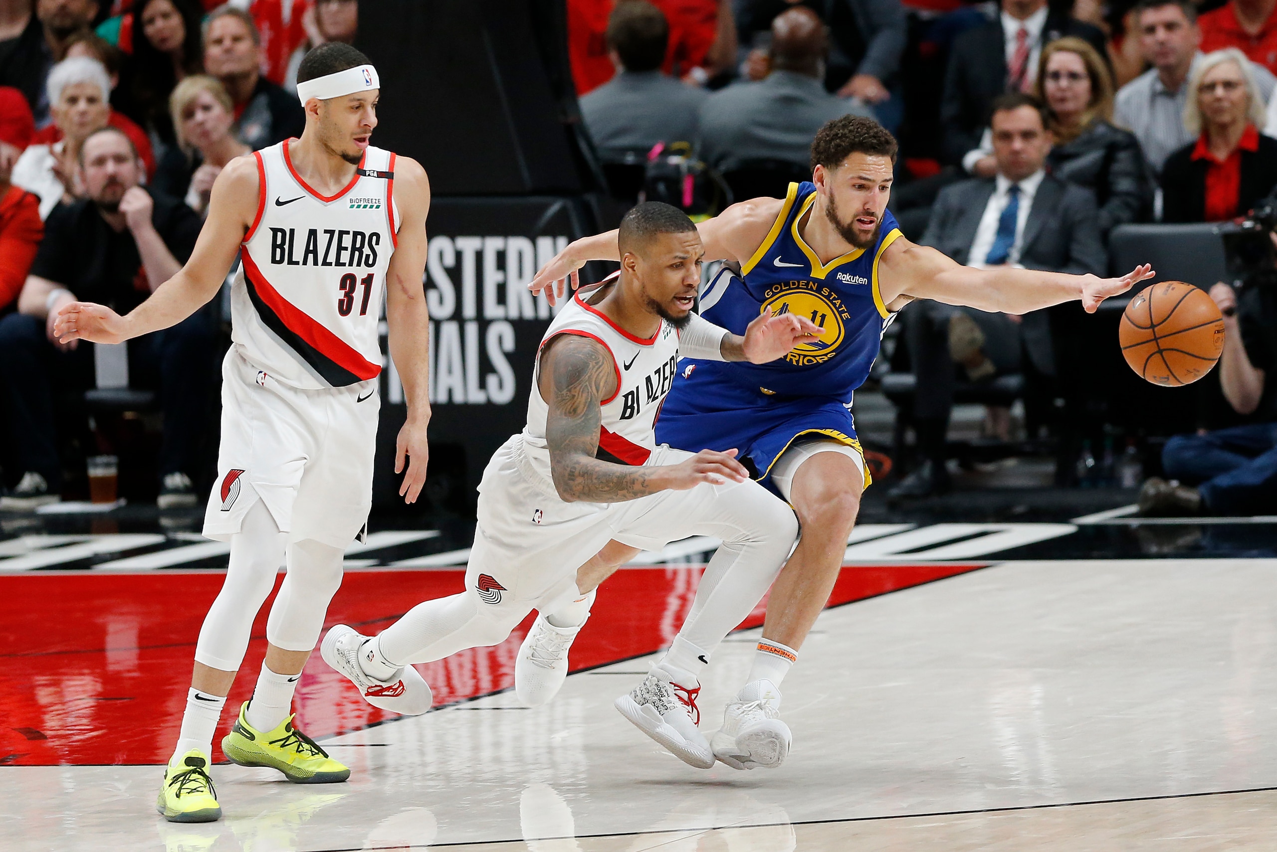 PORTLAND, OREGON - MAY 20: Klay Thompson #11 of the Golden State Warriors battles for the ball with Damian Lillard #0 of the Portland Trail Blazers during the second half in game four of the NBA Western Conference Finals at Moda Center on May 20, 2019 in 