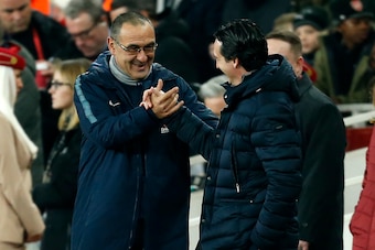 Chelsea's Italian head coach Maurizio Sarri (L) shakes hands with Arsenal's Spanish head coach Unai Emery before the English Premier League football match between Arsenal and Cheslea at the Emirates Stadium in London on January 19, 2019. (Photo by Ian KIN