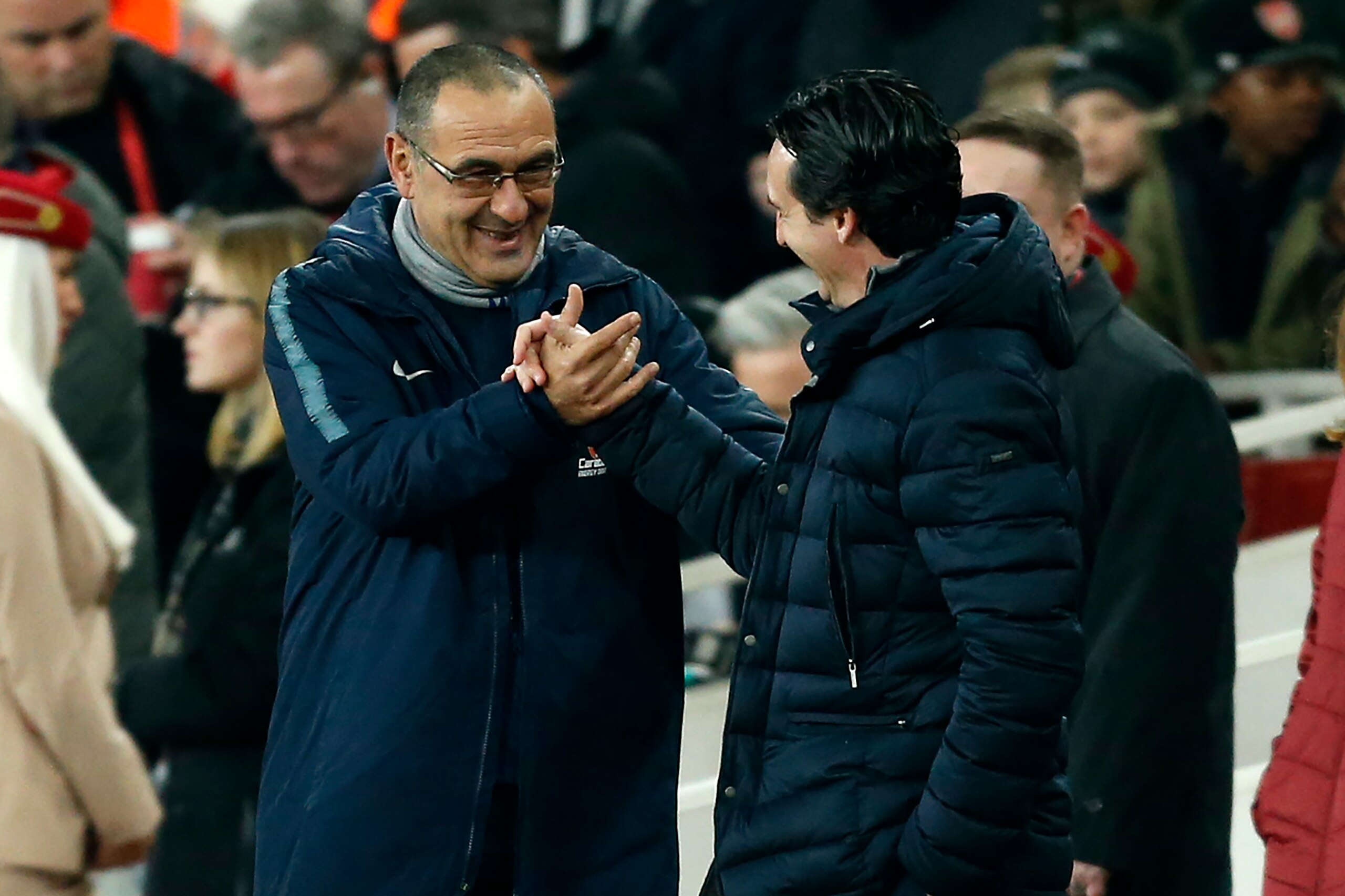 Chelsea's Italian head coach Maurizio Sarri (L) shakes hands with Arsenal's Spanish head coach Unai Emery before the English Premier League football match between Arsenal and Cheslea at the Emirates Stadium in London on January 19, 2019. (Photo by Ian KIN Chelsea's Italian head coach Maurizio Sarri (L) shakes hands with Arsenal's Spanish head coach Unai Emery before the English Premier League football match between Arsenal and Cheslea at the Emirates Stadium in London on January 19, 2019. (Photo by Ian KIN