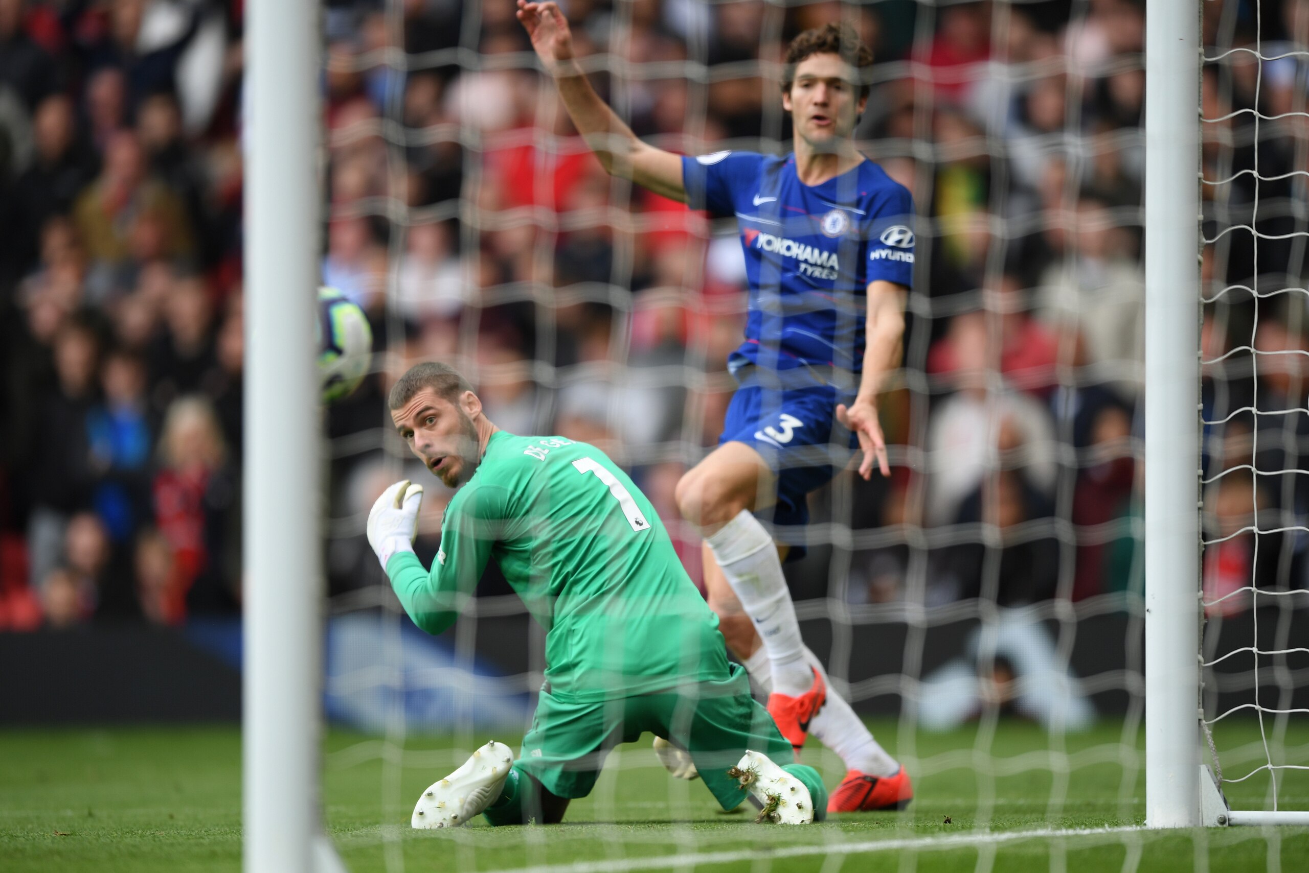 MANCHESTER, ENGLAND - APRIL 28:  David De Gea of Manchester United watches the ball as Marcos Alonso of Chelsea scores during the Premier League match between Manchester United and Chelsea FC at Old Trafford on April 28, 2019 in Manchester, United Kingdom