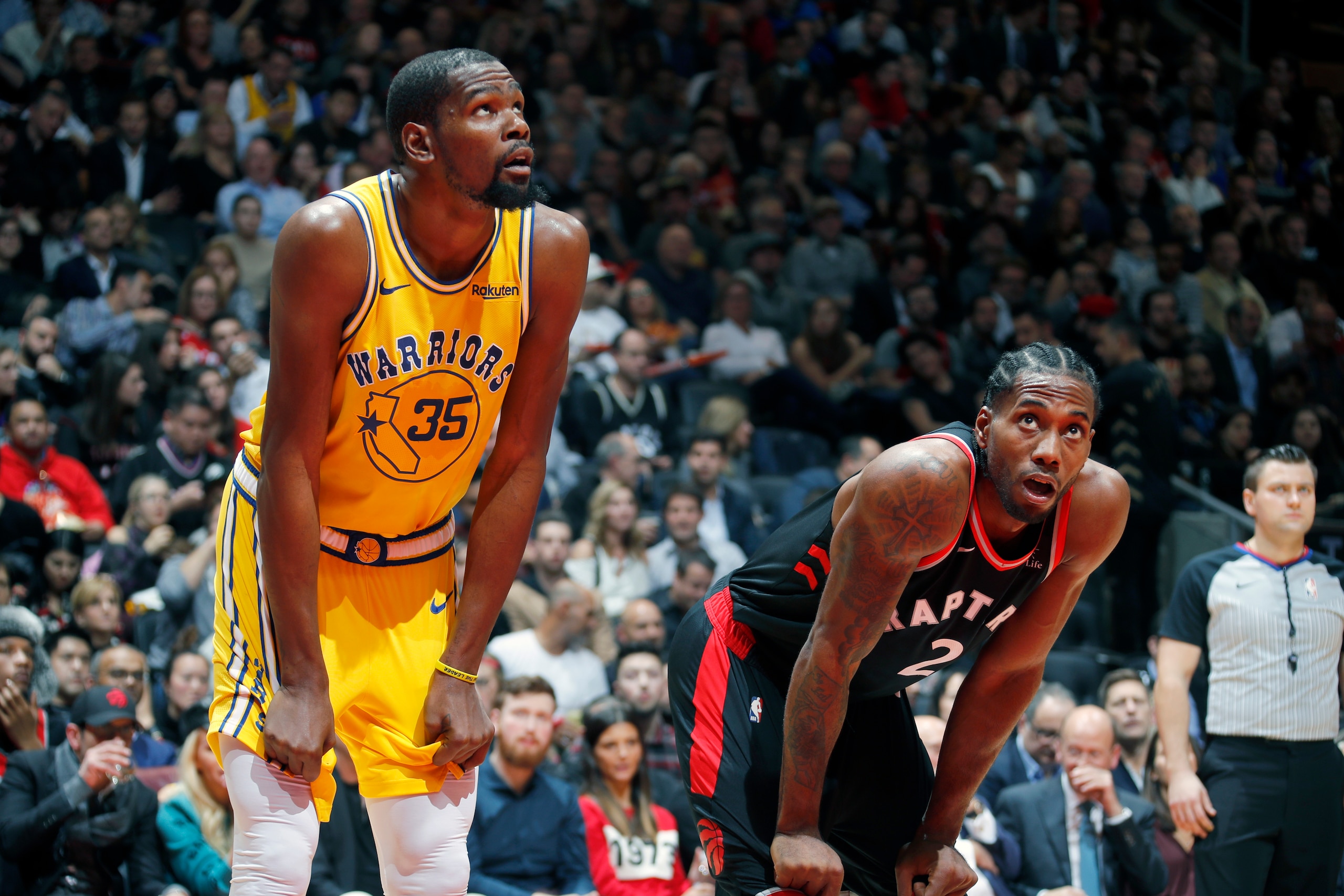 TORONTO, CANADA - NOVEMBER 29: Kevin Durant #35 of the Golden State Warriors and Kawhi Leonard #2 of the Toronto Raptors look on during the game on November 29, 2018 at Scotiabank Arena in Toronto, Ontario, Canada. NOTE TO USER: User expressly acknowledge