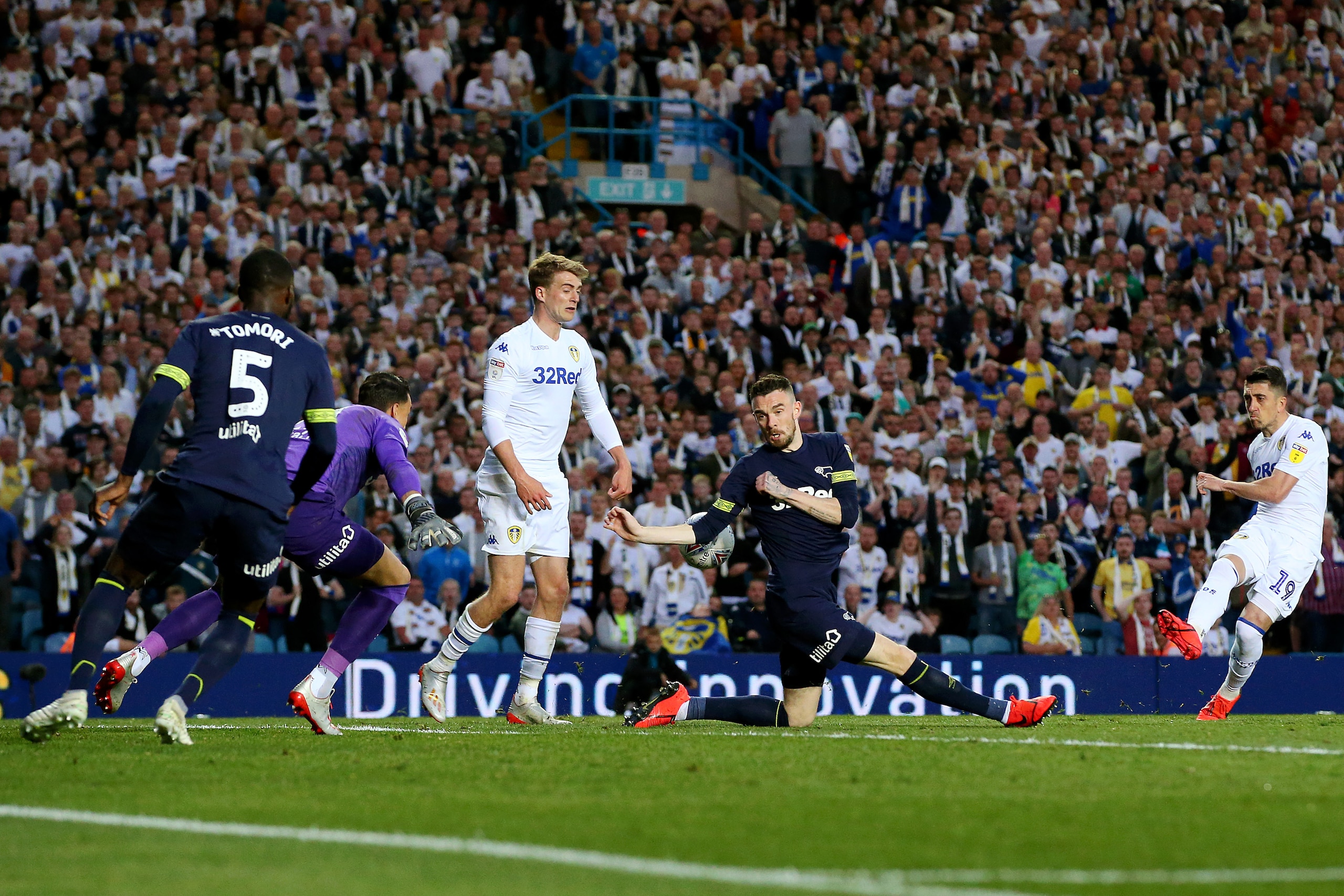 LEEDS, ENGLAND - MAY 15: Pablo Hernandez of Leeds United (R) shoots during the Sky Bet Championship Play-off semi final second leg match between Leeds United and Derby County at Elland Road on May 15, 2019 in Leeds, England. (Photo by Alex Livesey/Getty I