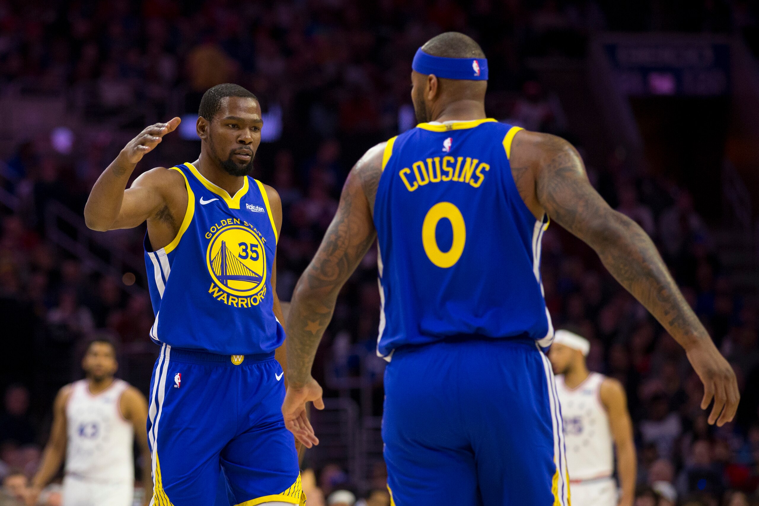 PHILADELPHIA, PA - MARCH 02: Kevin Durant #35 and DeMarcus Cousins #0 of the Golden State Warriors react against the Philadelphia 76ers at the Wells Fargo Center on March 2, 2019 in Philadelphia, Pennsylvania. The Warriors defeated the 76ers 120-117. NOTE
