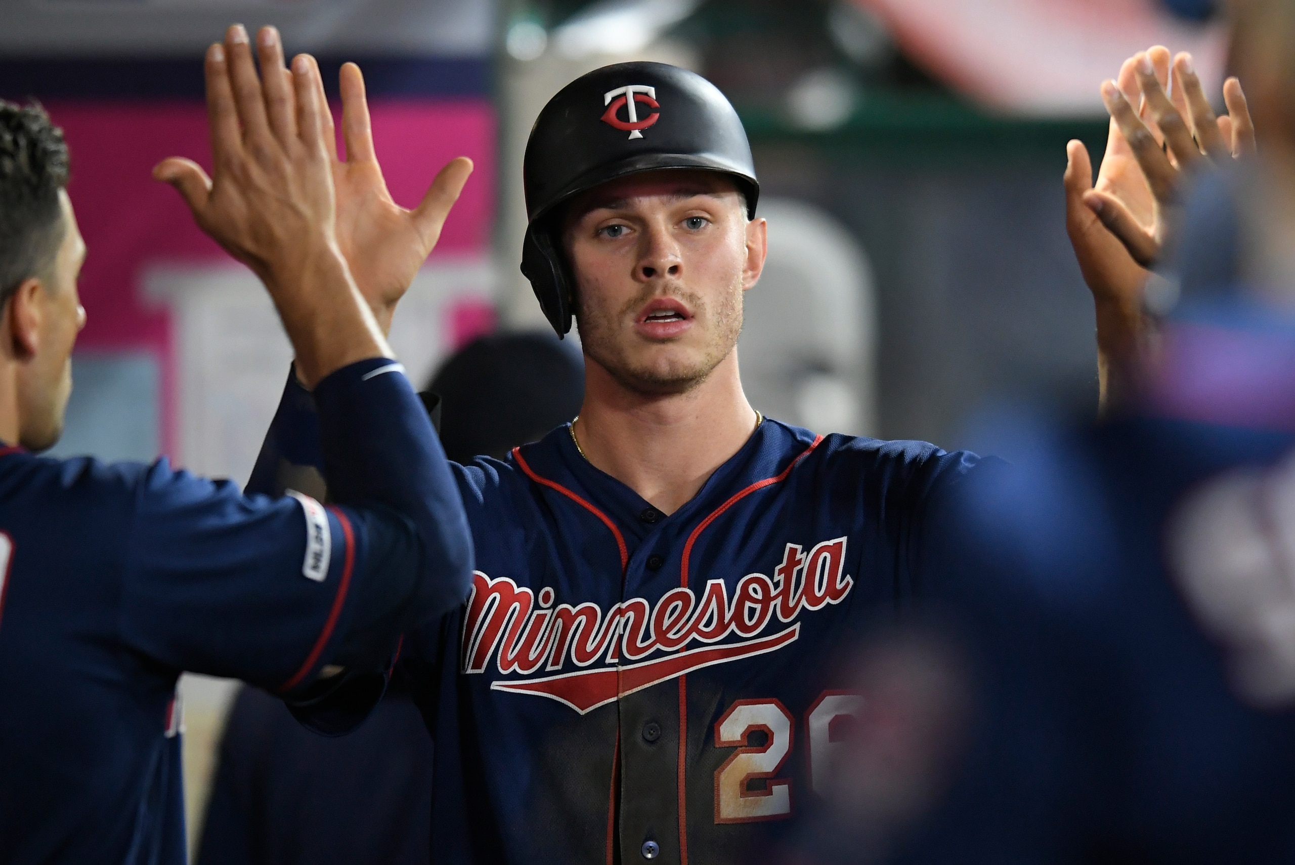 ANAHEIM, CA - MAY 21: Max Kepler #26 of the Minnesota Twins congratulated after being driven in on a double by Jorge Polanco #11 in the sixth inning against the Los Angeles Angels of Anaheim at Angel Stadium of Anaheim on May 21, 2019 in Anaheim, Californ