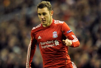 LIVERPOOL, ENGLAND - DECEMBER 15:  Fabio Aurelio of Liverpool runs with the ball during the UEFA Europa League Group K match between Liverpool and FC Utrecht at Anfield on December 15, 2010 in Liverpool, England.  (Photo by Clint Hughes/Getty Images)