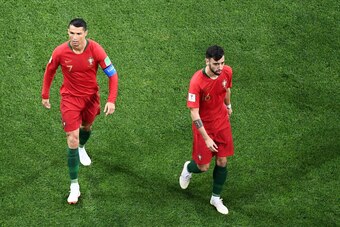 Portugal's forward Cristiano Ronaldo (L) reacts next to Portugal's midfielder Bruno Fernandes after scoring the opening goal during the Russia 2018 World Cup Group B football match between Portugal and Spain at the Fisht Stadium in Sochi on June 15, 2018.