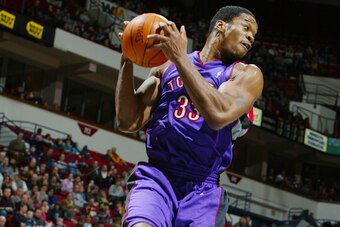 MINNEAPOLIS - JANUARY 20:  Antonio Davis #33 of the Toronto Raptors pulls down a rebound during the game against the Minnesota Timberwolves at Target Center on January 20, 2003 in Minneapolis, Minnesota.  The Timberwolves won 89-81.  NOTE TO USER: User ex