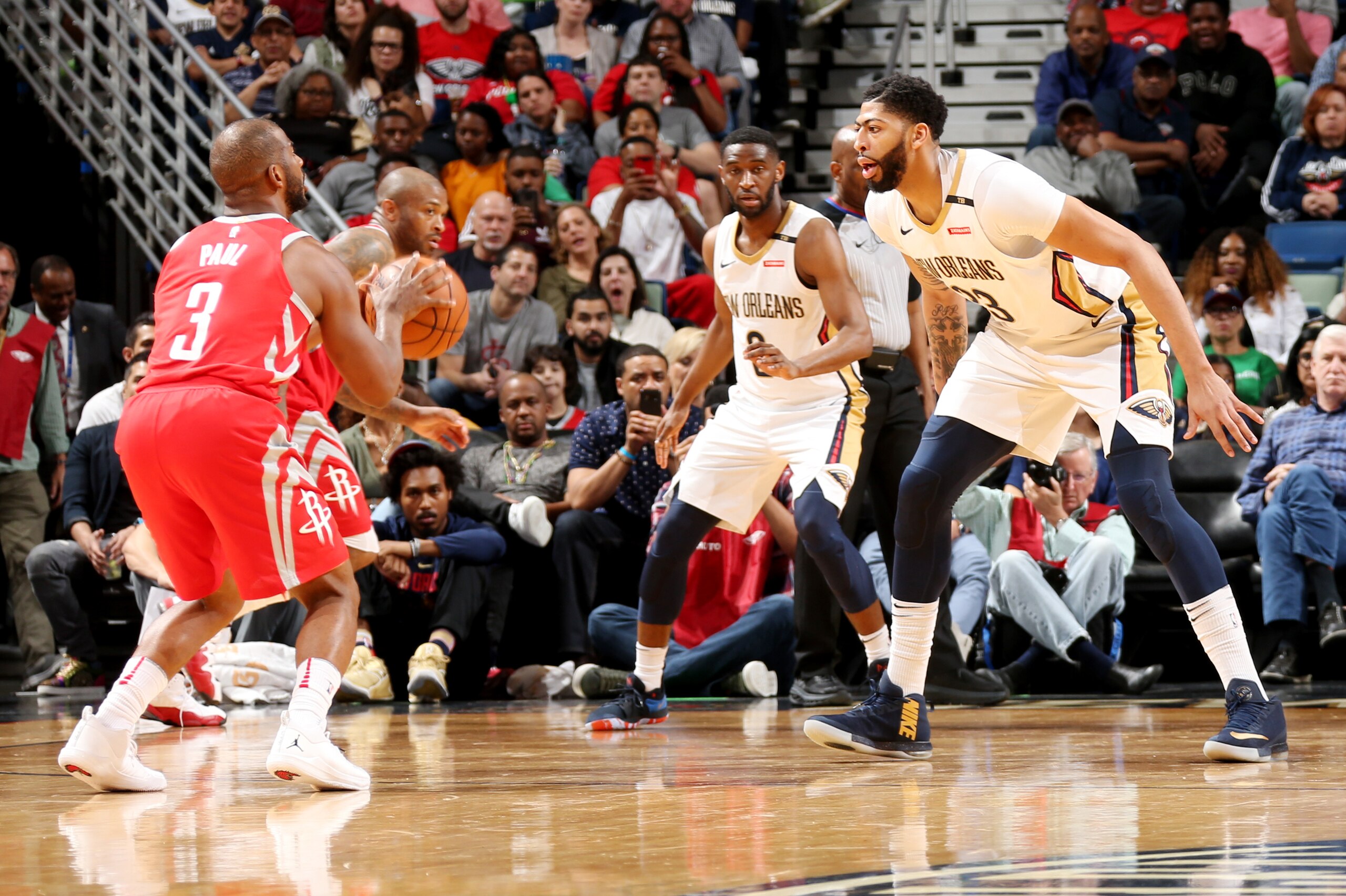 NEW ORLEANS, LA - MARCH 17:  Chris Paul #3 of the Houston Rockets handles the ball against Anthony Davis #23 of the New Orleans Pelicans during the game between the two teams on March 17, 2018 at the Smoothie King Center in New Orleans, Louisiana. NOTE TO