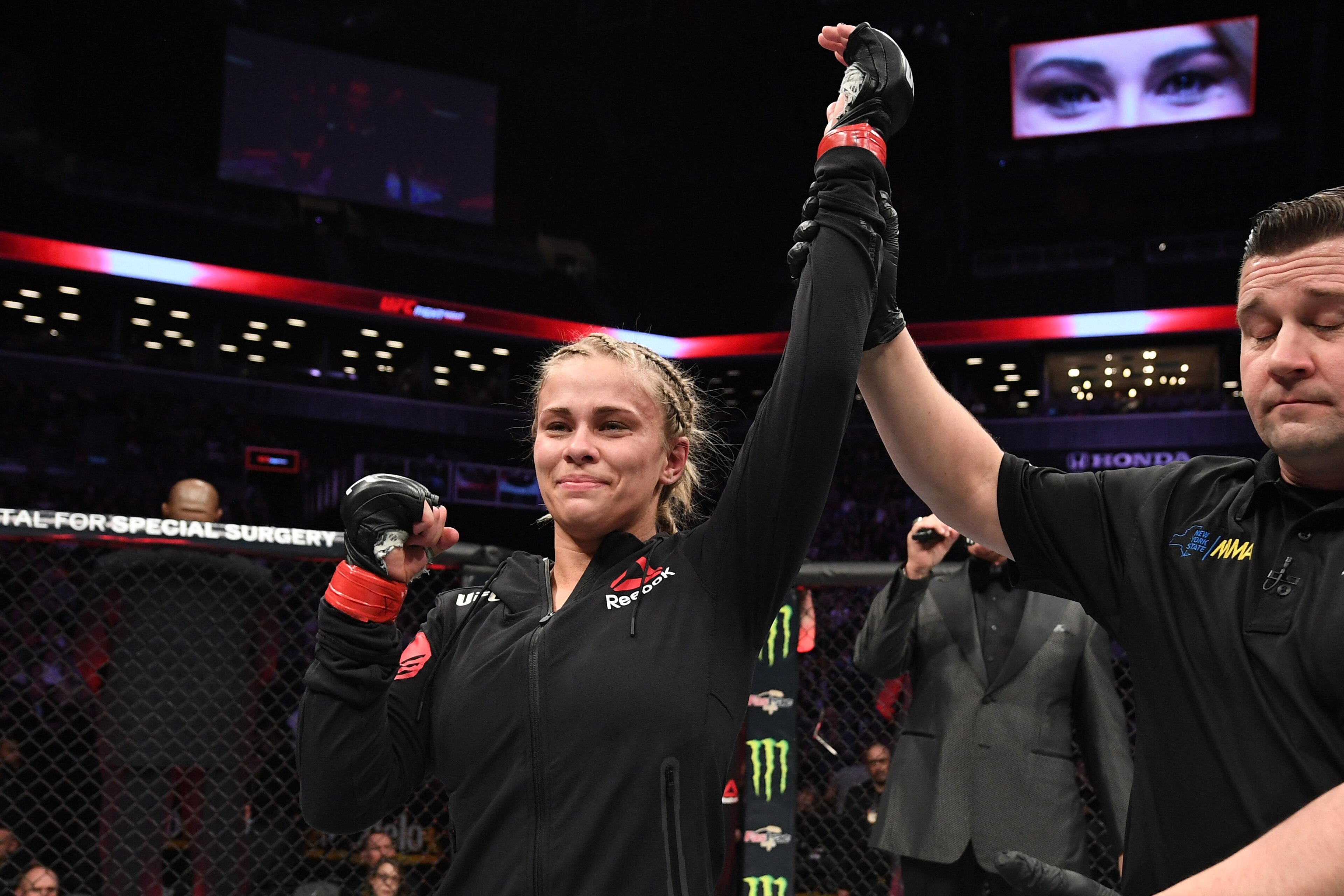 NEW YORK, NY - JANUARY 19:  Paige VanZant celebrates her victory over Rachael Ostovich in their women's flyweight bout during the UFC Fight Night event at the Barclays Center on January 19, 2019 in the Brooklyn borough of New York City. (Photo by Josh Hed