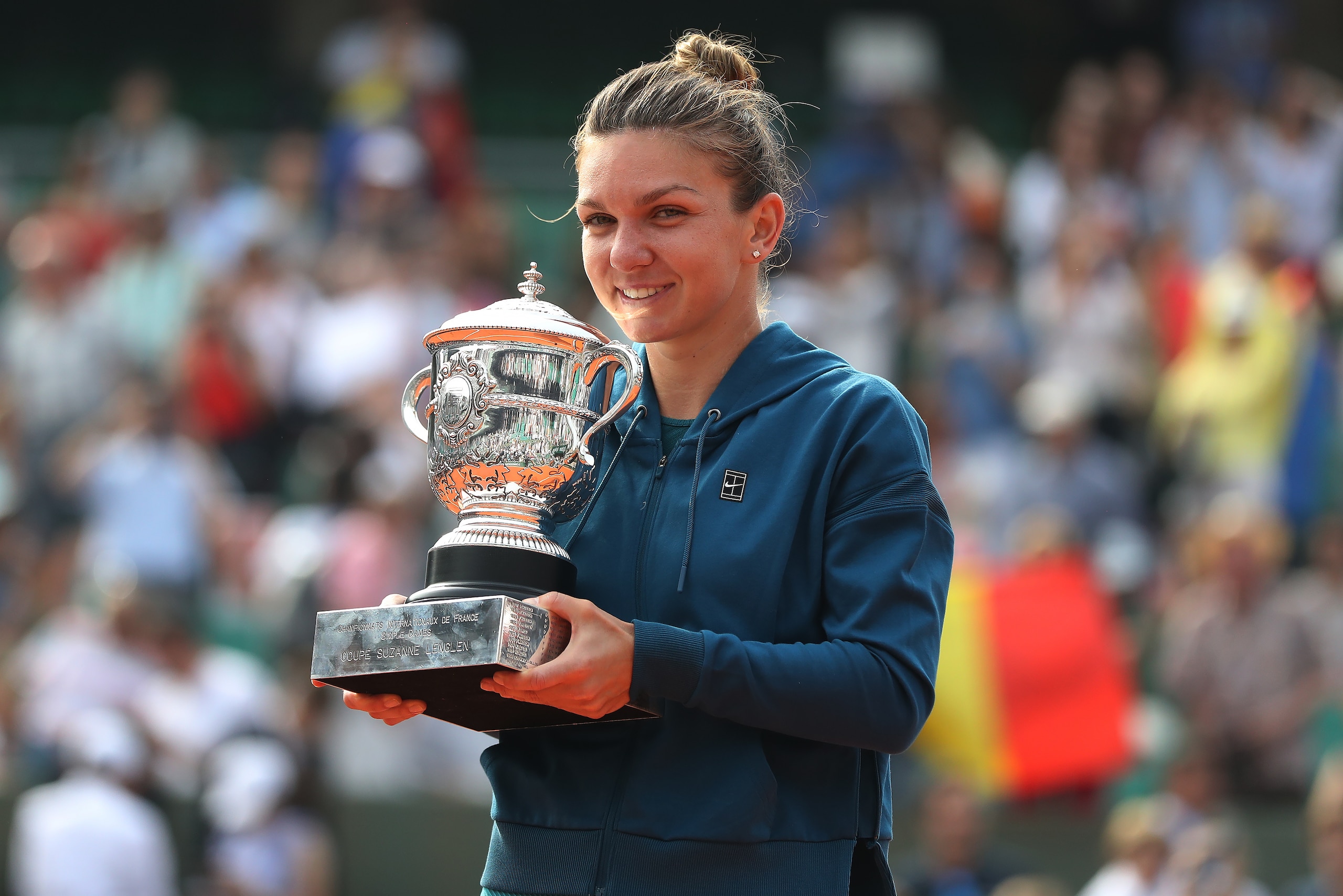 PARIS, FRANCE - JUNE 09:  Simona Halep of Romania poses with the trophy after her Women's Singles Final match against Sloane Stephens of United States during day fourteen of the 2018 French Open at Roland Garros on June 9, 2018 in Paris, France.  (Photo b