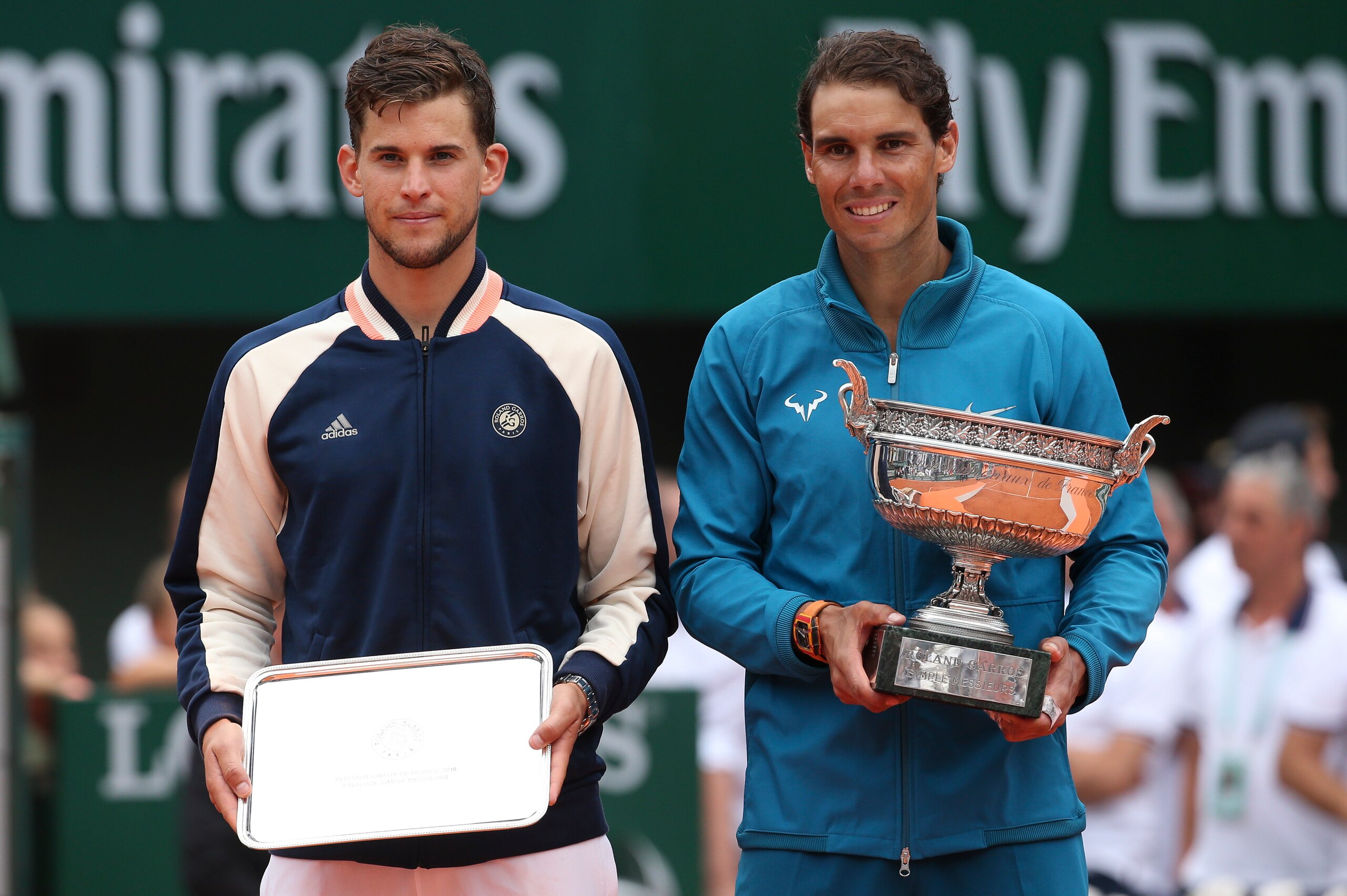 PARIS, FRANCE - JUNE 10: Finalist Dominic Thiem of Austria, winner Rafael Nadal of Spain during the trophy ceremony on Day 15 of the 2018 French Open at Roland Garros stadium on June 10, 2018 in Paris, France. (Photo by Jean Catuffe/Getty Images) PARIS, FRANCE - JUNE 10: Finalist Dominic Thiem of Austria, winner Rafael Nadal of Spain during the trophy ceremony on Day 15 of the 2018 French Open at Roland Garros stadium on June 10, 2018 in Paris, France. (Photo by Jean Catuffe/Getty Images)