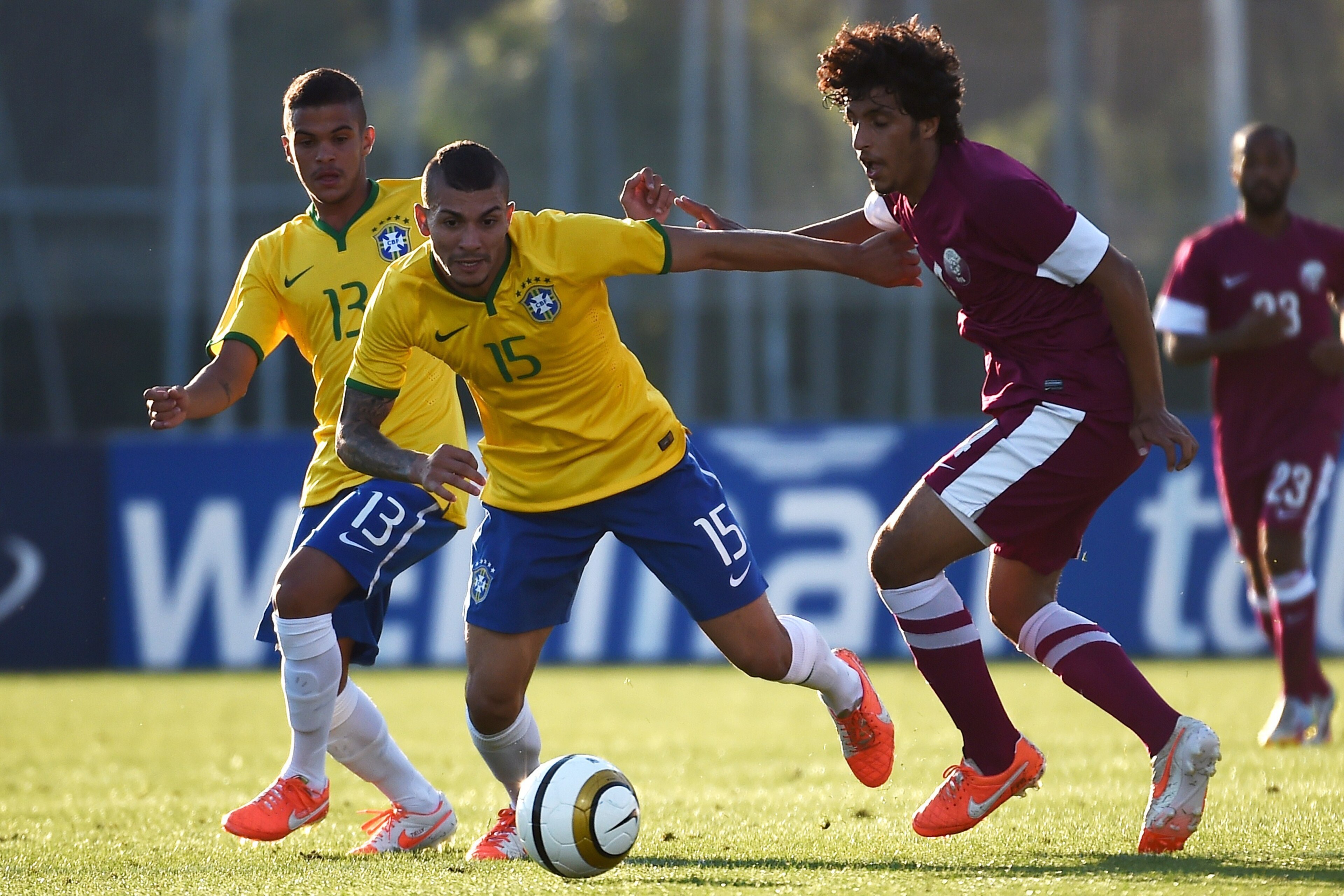 Brazilian mildfielder Alison (C) vies with Qatar forward Akram Afif (R) as Brasilian defender Auro (L) looks on during the Under 21 international football match between Brazil and Qatar, at the Leo Lagrange stadium in Toulon, southern France, on May 30, 2