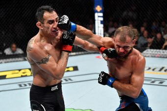 CHICAGO, IL - JUNE 08:  (R-L) Donald Cerrone and Tony Ferguson exchange punches in their lightweight bout during the UFC 238 event at the United Center on June 8, 2019 in Chicago, Illinois. (Photo by Jeff Bottari/Zuffa LLC/Zuffa LLC via Getty Images)