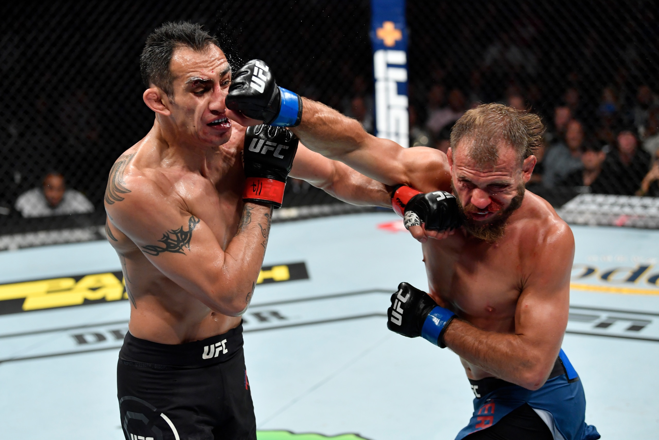 CHICAGO, IL - JUNE 08:  (R-L) Donald Cerrone and Tony Ferguson exchange punches in their lightweight bout during the UFC 238 event at the United Center on June 8, 2019 in Chicago, Illinois. (Photo by Jeff Bottari/Zuffa LLC/Zuffa LLC via Getty Images)