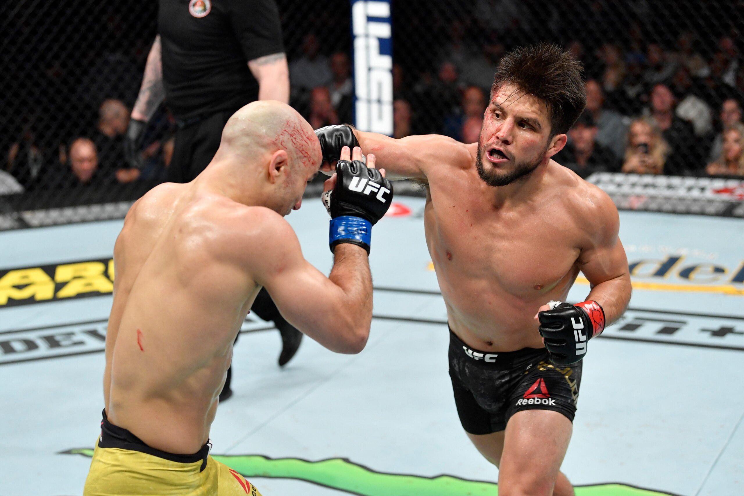 CHICAGO, IL - JUNE 08:  (R-L) Henry Cejudo punches Marlon Moraes of Brazil in their bantamweight championship bout during the UFC 238 event at the United Center on June 8, 2019 in Chicago, Illinois. (Photo by Jeff Bottari/Zuffa LLC/Zuffa LLC via Getty Ima