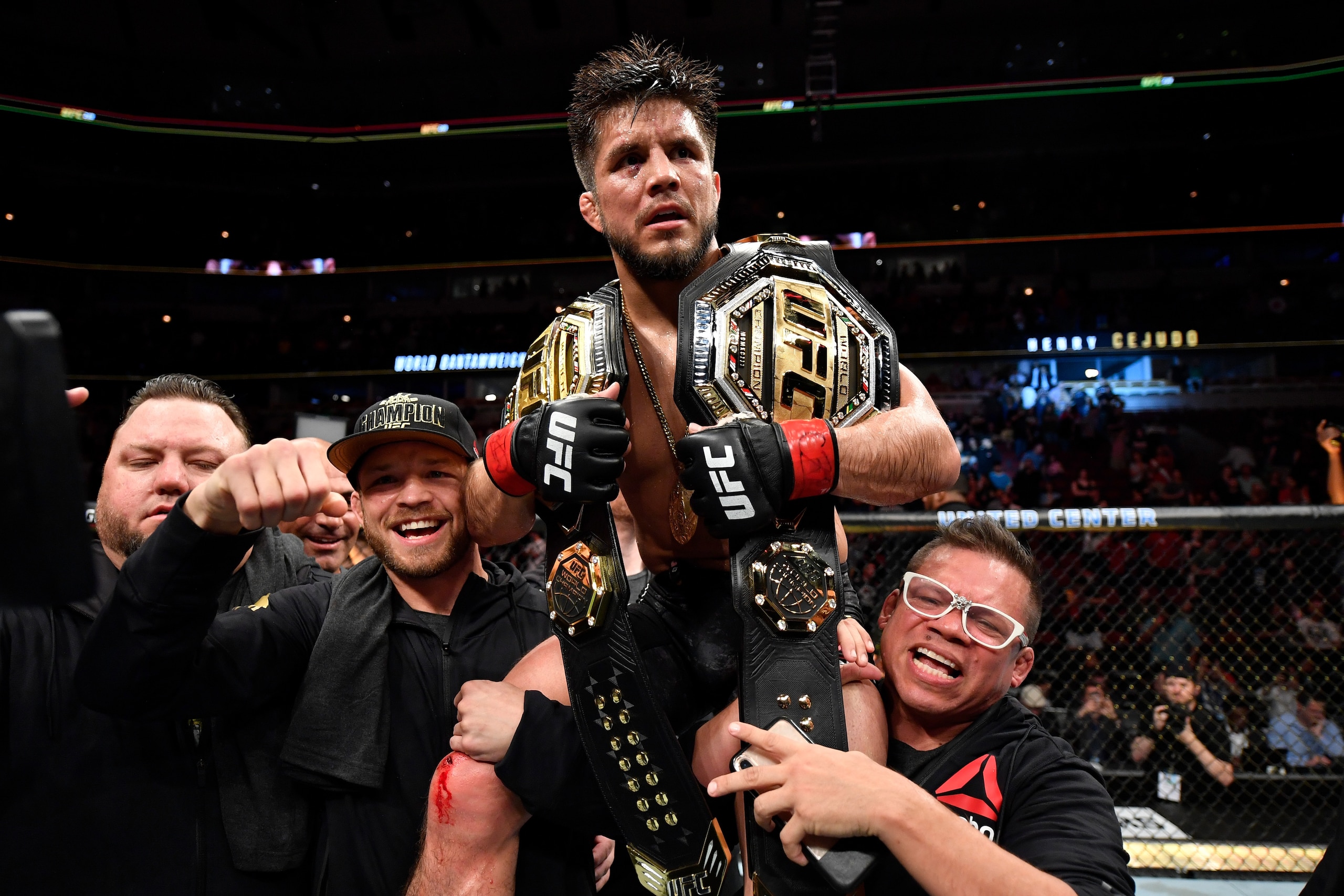 CHICAGO, IL - JUNE 08:  Henry Cejudo celebrates his TKO victory over Marlon Moraes of Brazil in their bantamweight championship bout during the UFC 238 event at the United Center on June 8, 2019 in Chicago, Illinois. (Photo by Jeff Bottari/Zuffa LLC/Zuffa