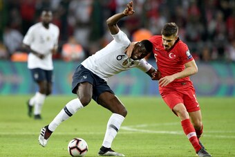France's Midfielder Paul Pogba (L) vies with Turkey's midfielder Dorukhan Tokoz during the Euro 2020 football qualification match between Turkey and France at the Buyuksehir Belediyesi stadium in Konya, on June 8, 2019. (Photo by Bulent Kilic / AFP)      