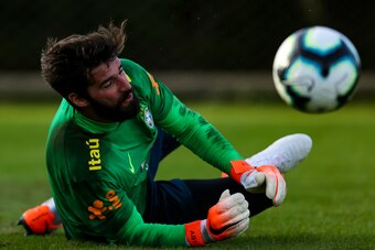 PORTO ALEGRE, BRAZIL - JUNE 07: Goalkeeper Alisson makes a save in a training session at the Gremio team training centre on June 07, 2019 in Porto Alegre, Brazil. (Photo by Buda Mendes/Getty Images)