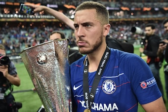 Chelsea's Belgian midfielder Eden Hazard holds the trophy after winning the UEFA Europa League final football match between Chelsea FC and Arsenal FC at the Baku Olympic Stadium in Baku, Azerbaijian, on May 29, 2019. (Photo by OZAN KOSE / AFP)        (Pho