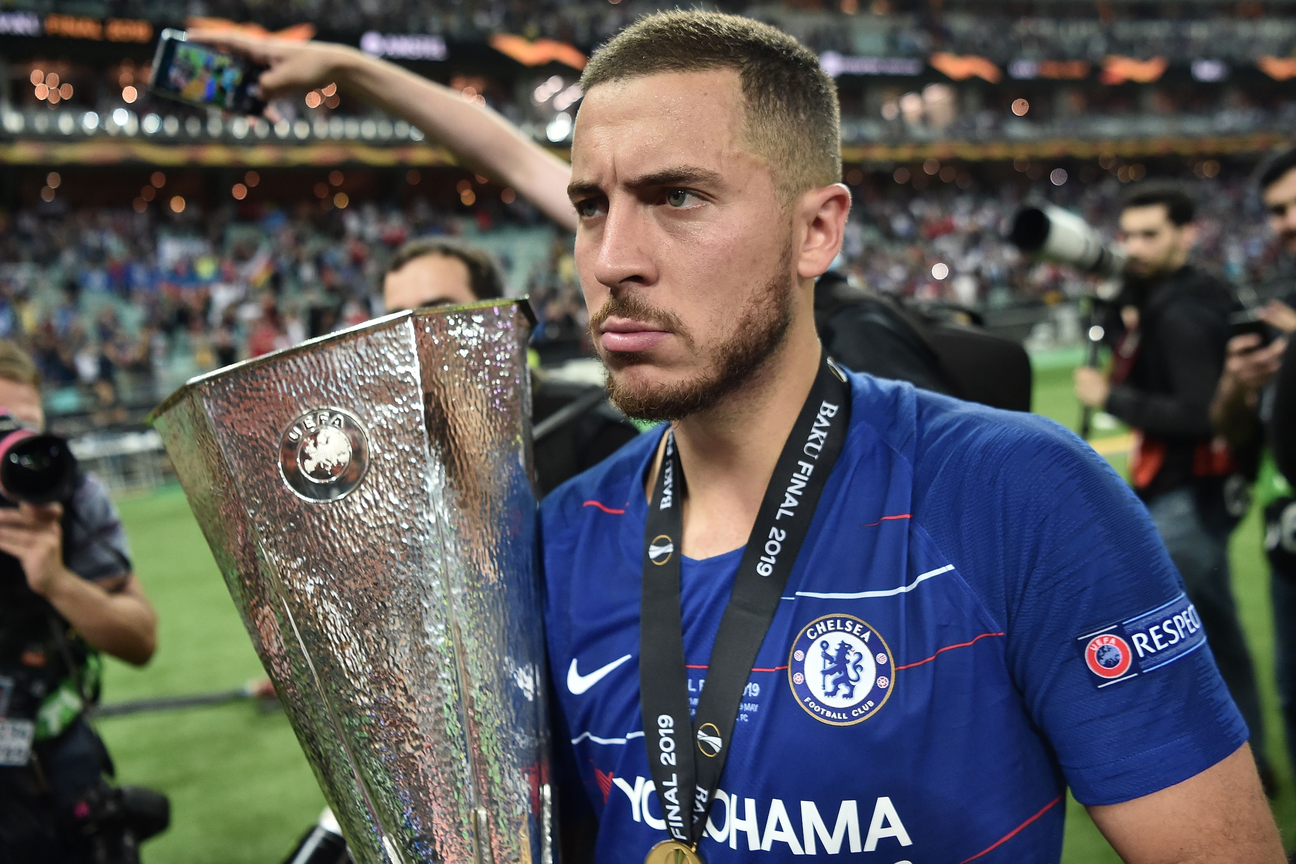 Chelsea's Belgian midfielder Eden Hazard holds the trophy after winning the UEFA Europa League final football match between Chelsea FC and Arsenal FC at the Baku Olympic Stadium in Baku, Azerbaijian, on May 29, 2019. (Photo by OZAN KOSE / AFP) (Pho Chelsea's Belgian midfielder Eden Hazard holds the trophy after winning the UEFA Europa League final football match between Chelsea FC and Arsenal FC at the Baku Olympic Stadium in Baku, Azerbaijian, on May 29, 2019. (Photo by OZAN KOSE / AFP) (Pho