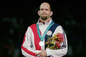 SYDNEY - SEPTEMBER 26:  Matt James Lindland of the USA receives a Bronze medal in the Men's Greco Roman Wrestling during the Sydney 2000 Olympic Games on September 26,2000 at the Exhibition Hall in Sydney, Austraila. (Photo by Al Bello/Getty Images)
