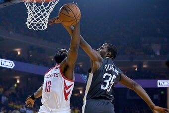OAKLAND, CA - APRIL 30:  James Harden #13 of the Houston Rockets has his shot blocked by Kevin Durant #35 of the Golden State Warriors in Game Two of the Second Round of the 2019 NBA Western Conference Playoffs at ORACLE Arena on April 30, 2019 in Oakland