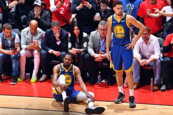 TORONTO, CANADA - JUNE 10: Kevin Durant #35 of the Golden State Warriors reacts to his leg injury during a game against the Toronto Raptors during Game Five of the NBA Finals on June 10, 2019 at Scotiabank Arena in Toronto, Ontario, Canada. NOTE TO USER: 