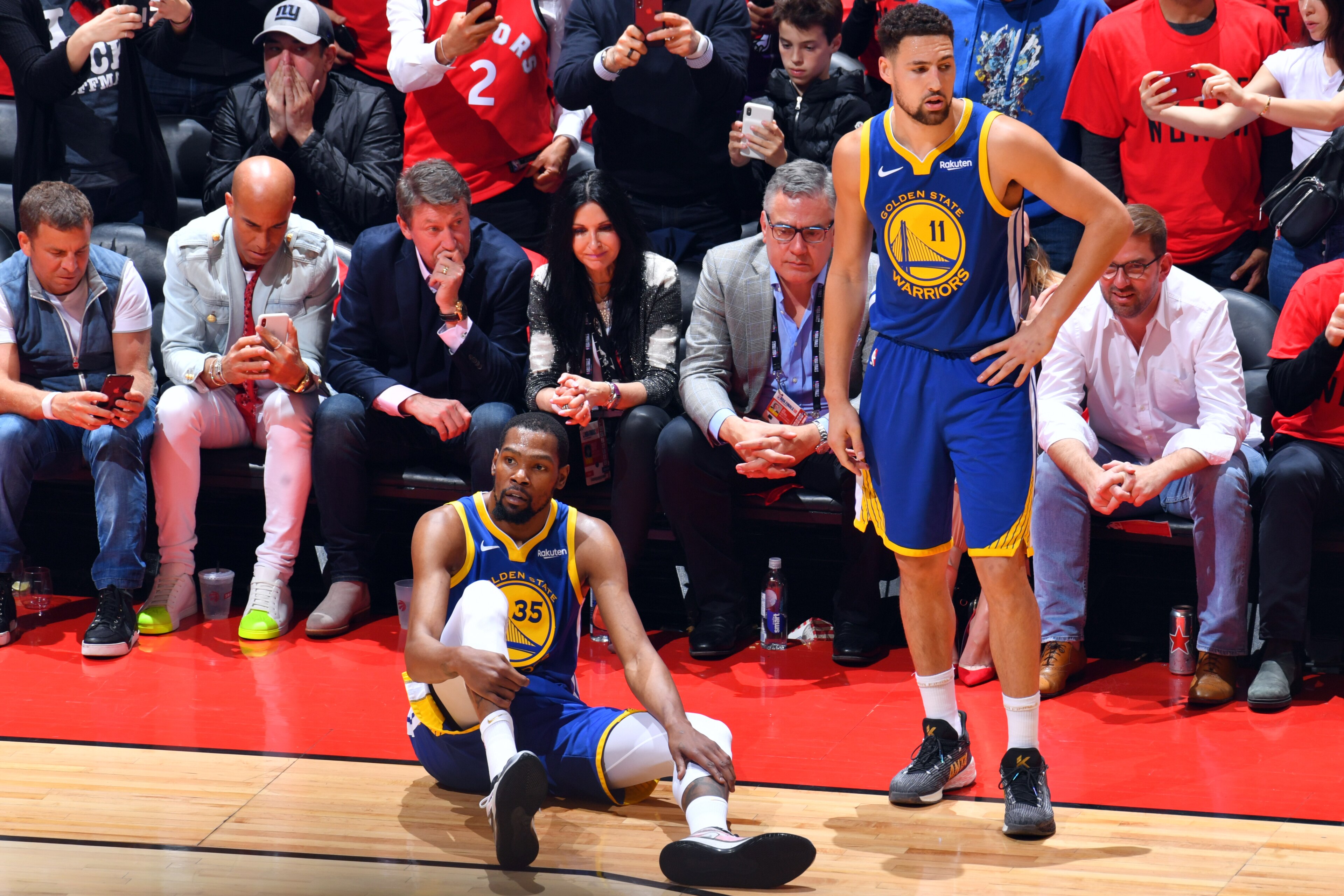 TORONTO, CANADA - JUNE 10: Kevin Durant #35 of the Golden State Warriors reacts to his leg injury during a game against the Toronto Raptors during Game Five of the NBA Finals on June 10, 2019 at Scotiabank Arena in Toronto, Ontario, Canada. NOTE TO USER: 
