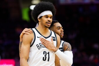 CLEVELAND, OH - FEBRUARY 13: Jarrett Allen #31 and D'Angelo Russell #1 of the Brooklyn Nets celebrate after scoring during the second overtime against the Cleveland Cavaliers at Quicken Loans Arena on February 13, 2019 in Cleveland, Ohio. The Nets defeate