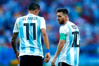 Argentina's forward Lionel Messi looks at Argentina's forward Angel Di Maria during the Russia 2018 World Cup round of 16 football match between France and Argentina at the Kazan Arena in Kazan on June 30, 2018. (Photo by BENJAMIN CREMEL / AFP) / RESTRICT