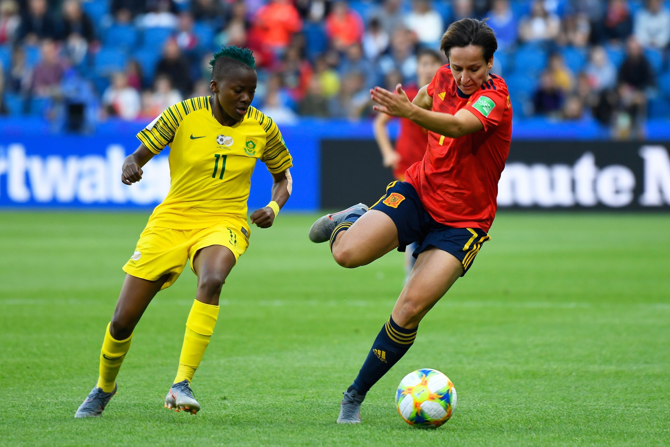 South Africa's forward Thembi Kgatlana (L) vies for the ball with Spain's midfielder Marta Corredera during the France 2019 Women's World Cup Group B football match between Spain and South Africa, on June 8, 2019, at the Oceane Stadium in Le Havre, northw