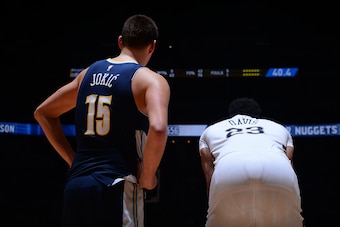 DENVER, CO - NOVEMBER 17: Nikola Jokic #15 of the Denver Nuggets and Anthony Davis #23 of the New Orleans Pelicans looks on during the game on November 17, 2017 at the Pepsi Center in Denver, Colorado. NOTE TO USER: User expressly acknowledges and agrees 