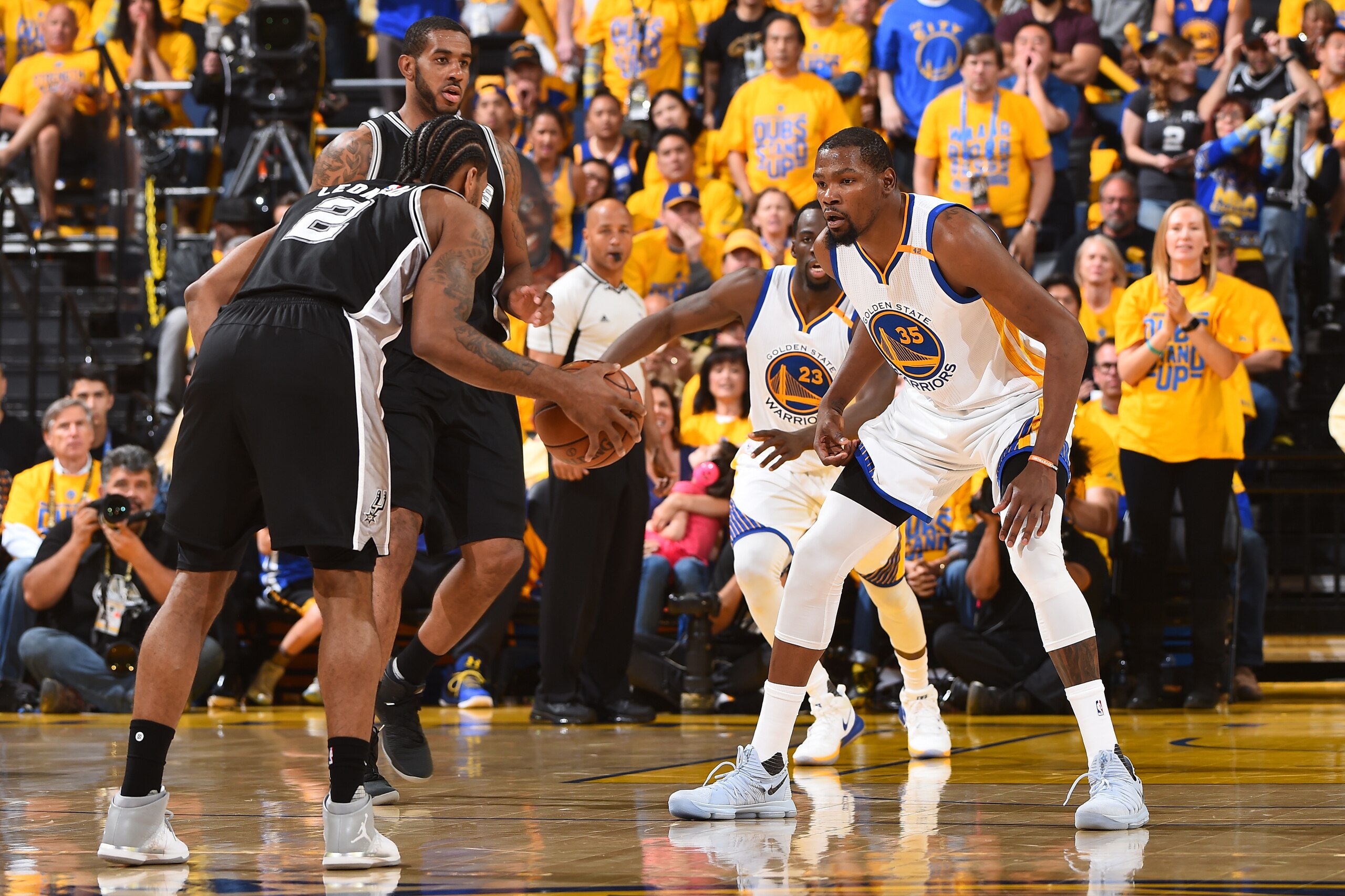OAKLAND, CA - MAY 14:  Kevin Durant #35 of the Golden State Warriors plays defense against Kawhi Leonard #2 of the San Antonio Spurs in Game One of the Western Conference Finals during the 2017 NBA Playoffs on May 14, 2017 at ORACLE Arena in Oakland, Cali