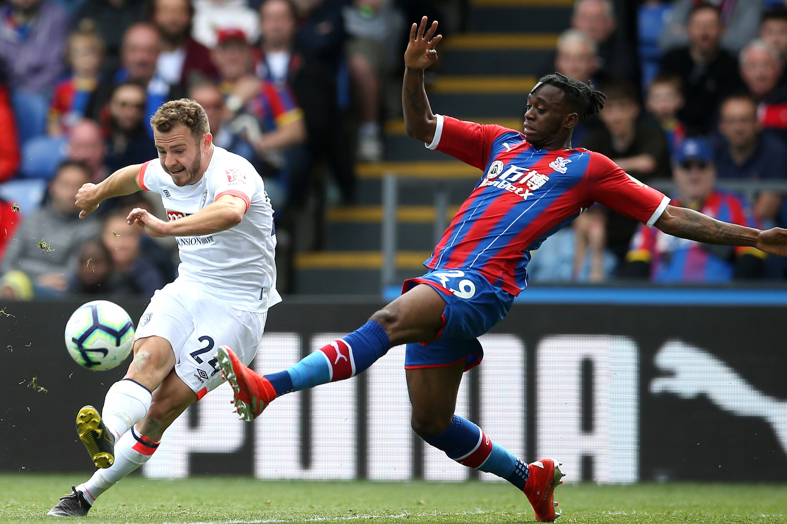 LONDON, ENGLAND - MAY 12: Aaron Wan-Bissaka of Crystal Palace is challenged by Ryan Fraser of AFC Bournemouth during the Premier League match between Crystal Palace and AFC Bournemouth at Selhurst Park on May 12, 2019 in London, United Kingdom. (Photo by 