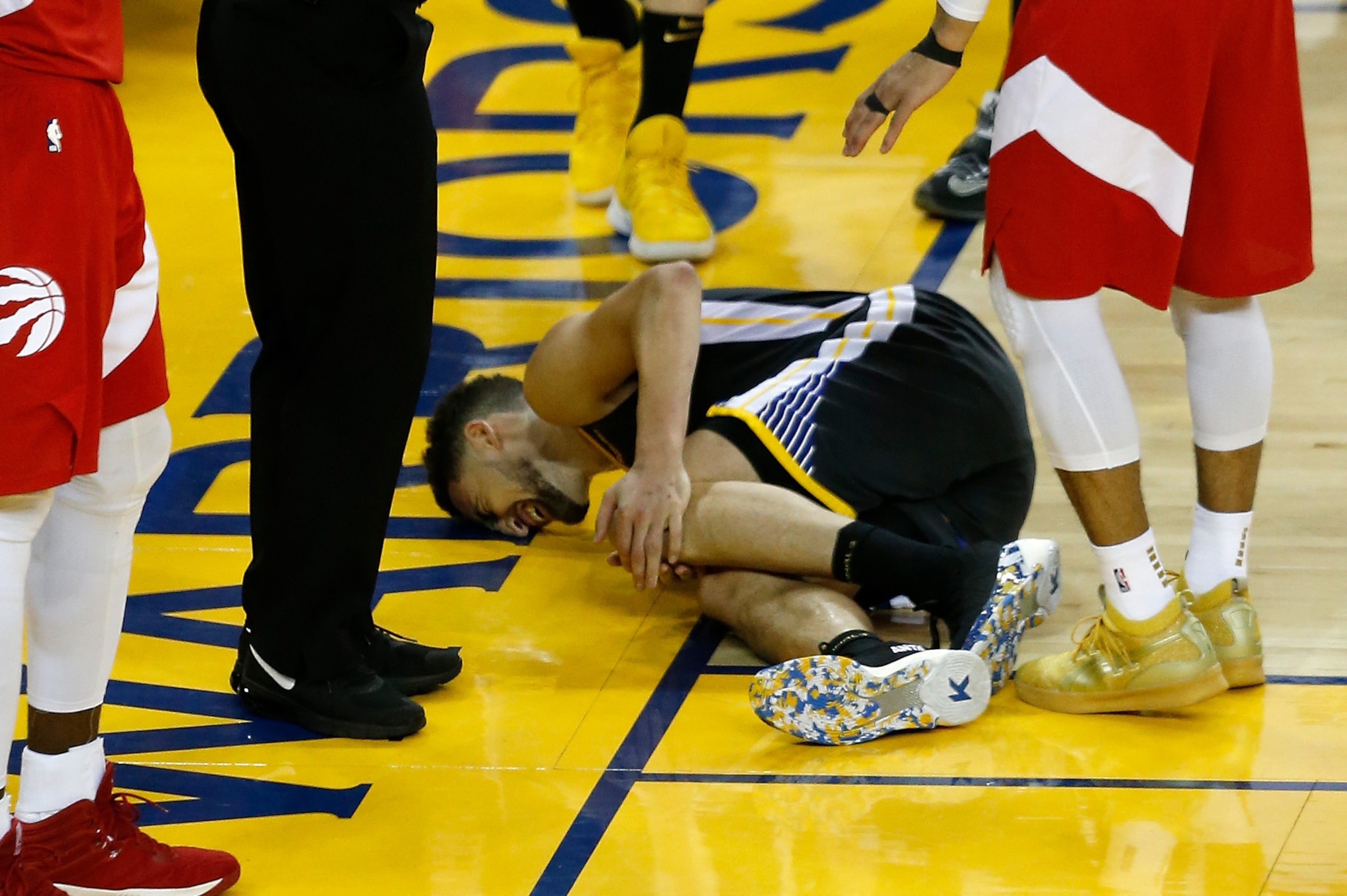 OAKLAND, CALIFORNIA - JUNE 13:  Klay Thompson #11 of the Golden State Warriors reacts after hurting his leg against the Toronto Raptors in the second half during Game Six of the 2019 NBA Finals at ORACLE Arena on June 13, 2019 in Oakland, California. NOTE
