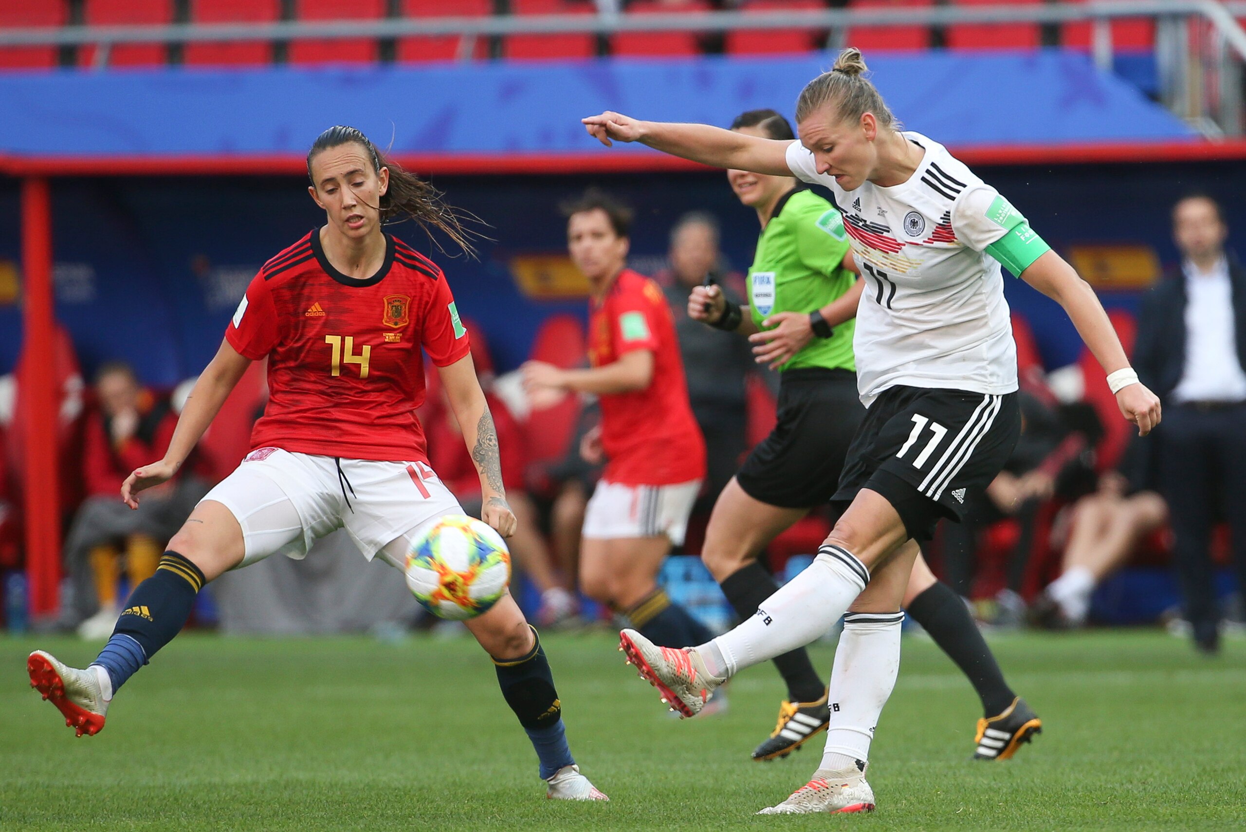 VALENCIENNES, FRANCE - JUNE 12: Alexandra Popp of Germany kicks the ball against Virginia Torrecilla of Spain during the 2019 FIFA Women's World Cup France group B match between Germany and Spain at Stade du Hainaut on June 12, 2019 in Valenciennes, Franc