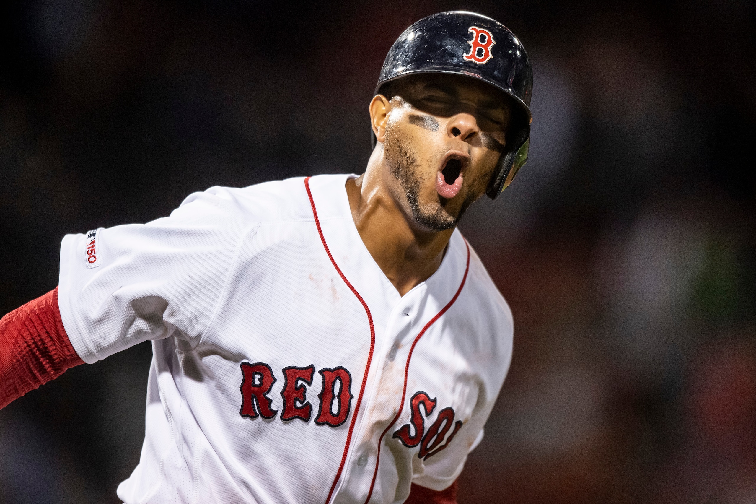 BOSTON, MA - JUNE 13: Xander Bogaerts #2 of the Boston Red Sox reacts after hitting a go ahead solo home run during the seventh inning of a game against the Texas Rangers on June 13, 2019 at Fenway Park in Boston, Massachusetts. (Photo by Billie Weiss/Bos