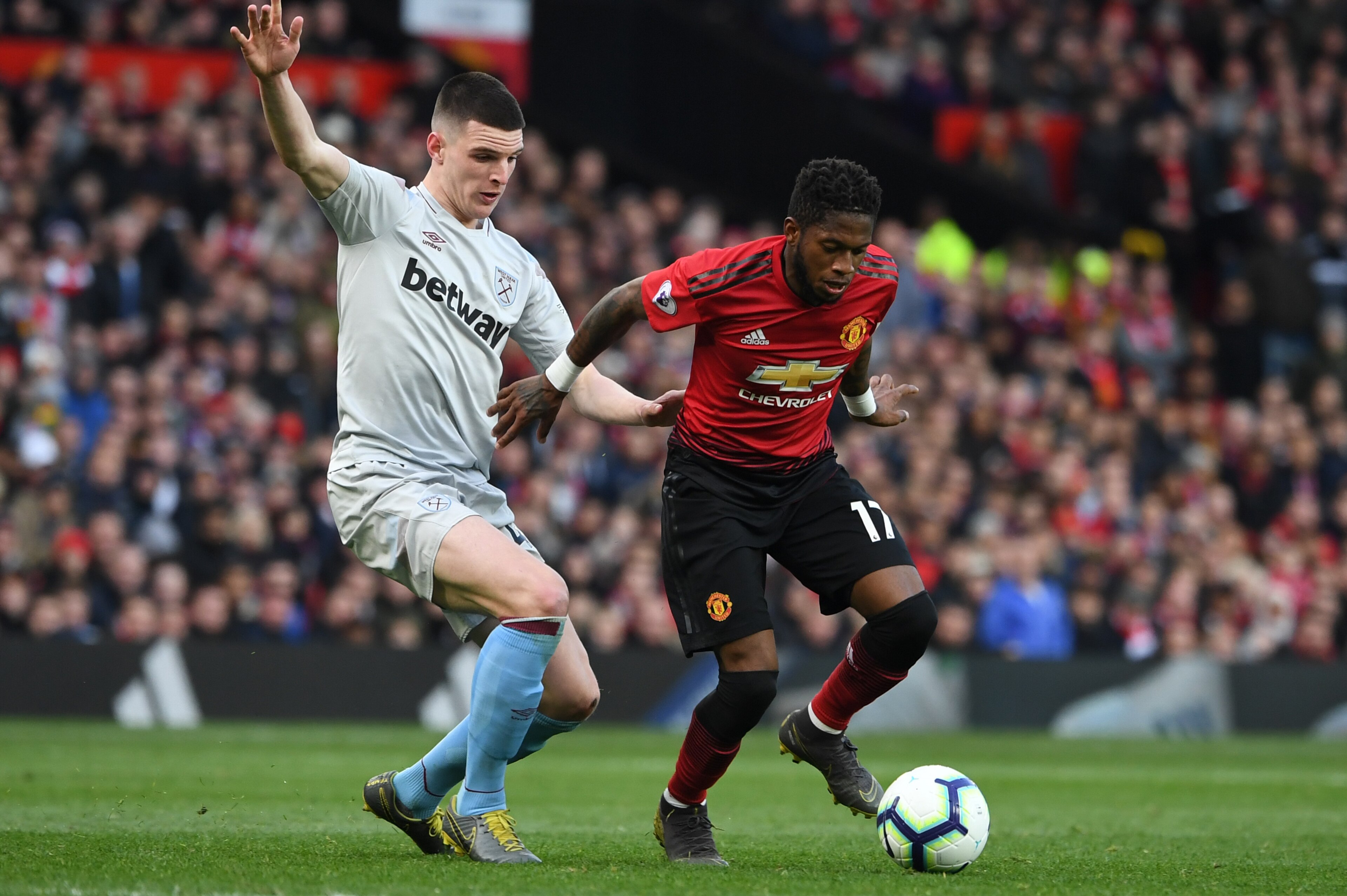 West Ham United's Irish defender Declan Rice (L) vies with Manchester United's Brazilian midfielder Fred during the English Premier League football match between Manchester United and West Ham United at Old Trafford in Manchester, north west England, on A West Ham United's Irish defender Declan Rice (L) vies with Manchester United's Brazilian midfielder Fred during the English Premier League football match between Manchester United and West Ham United at Old Trafford in Manchester, north west England, on A